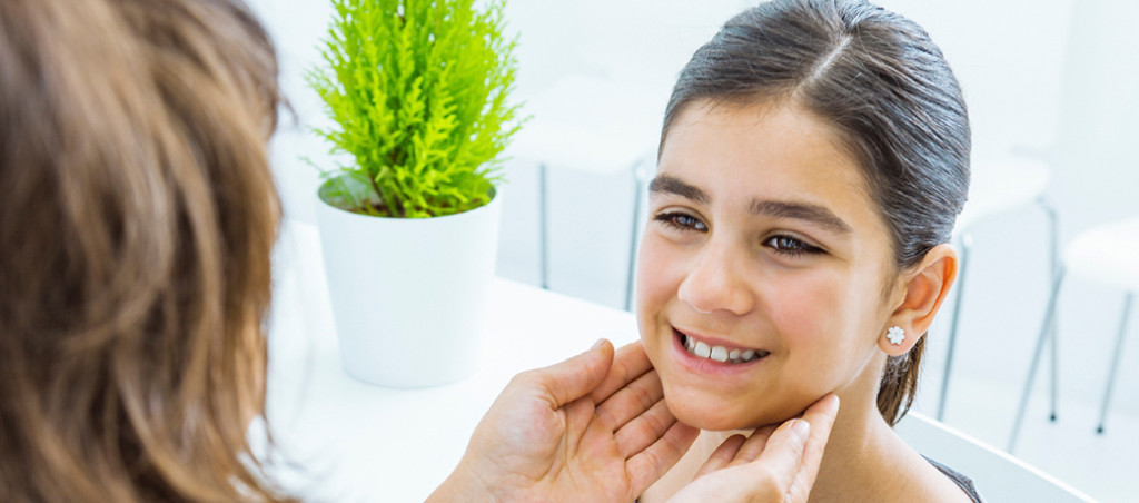 Doctor Checking Young Girls Throat