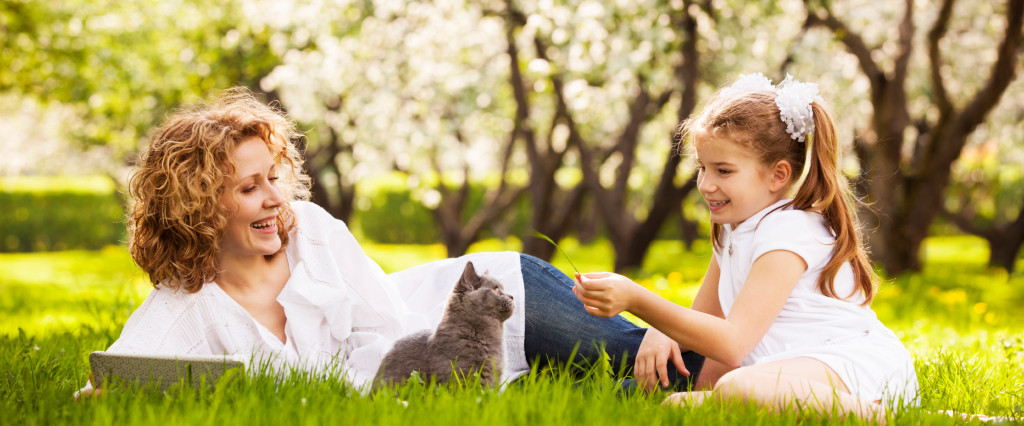 Mother and Daughter Outside with Cat